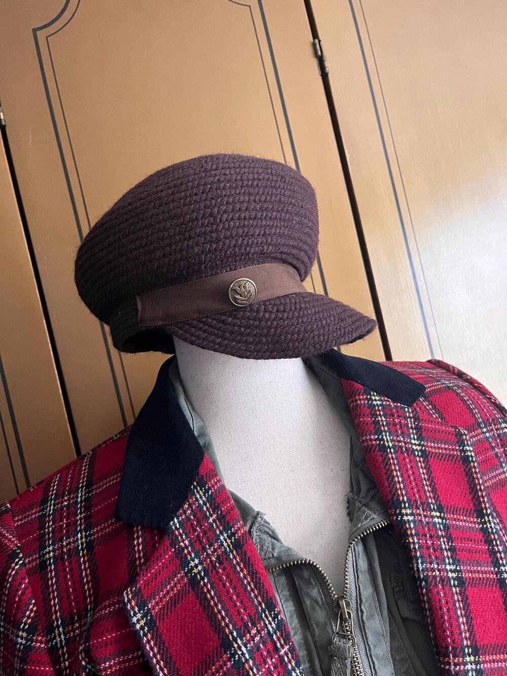 Brown woven cap with gros grain trim and buttons